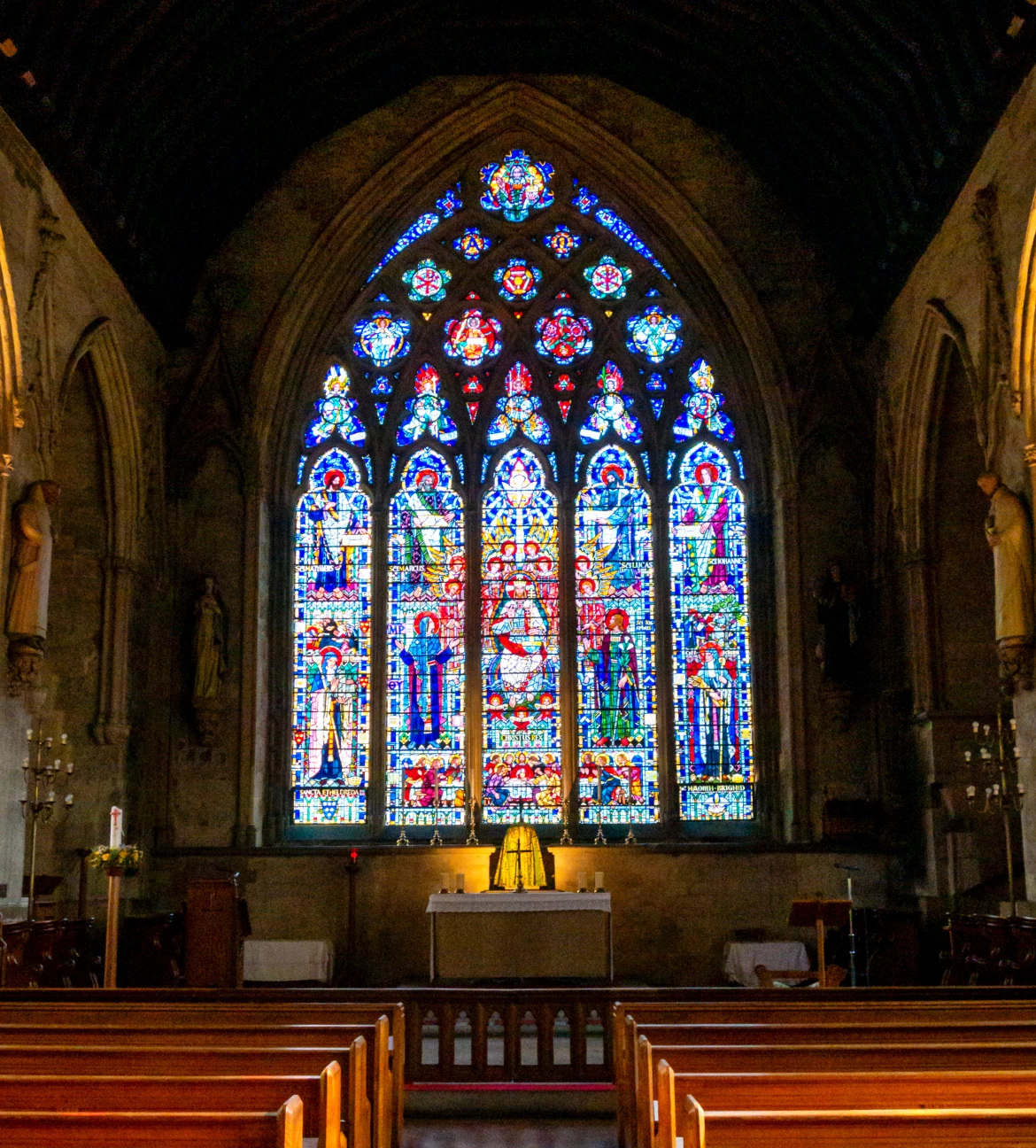 Church interior with colorful stained glass windows.