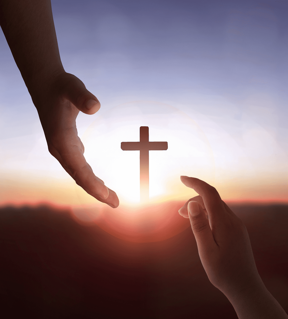 Hands reaching towards cross at sunset.