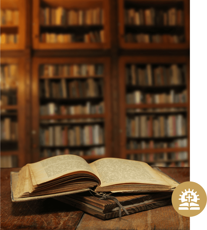 Open book on wooden table, library background.