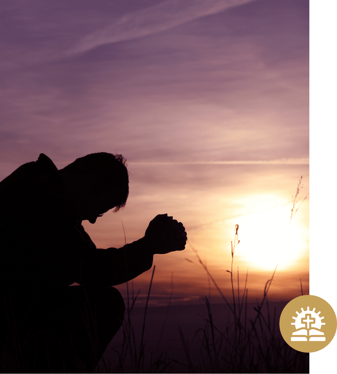 Silhouette of person praying at sunset.