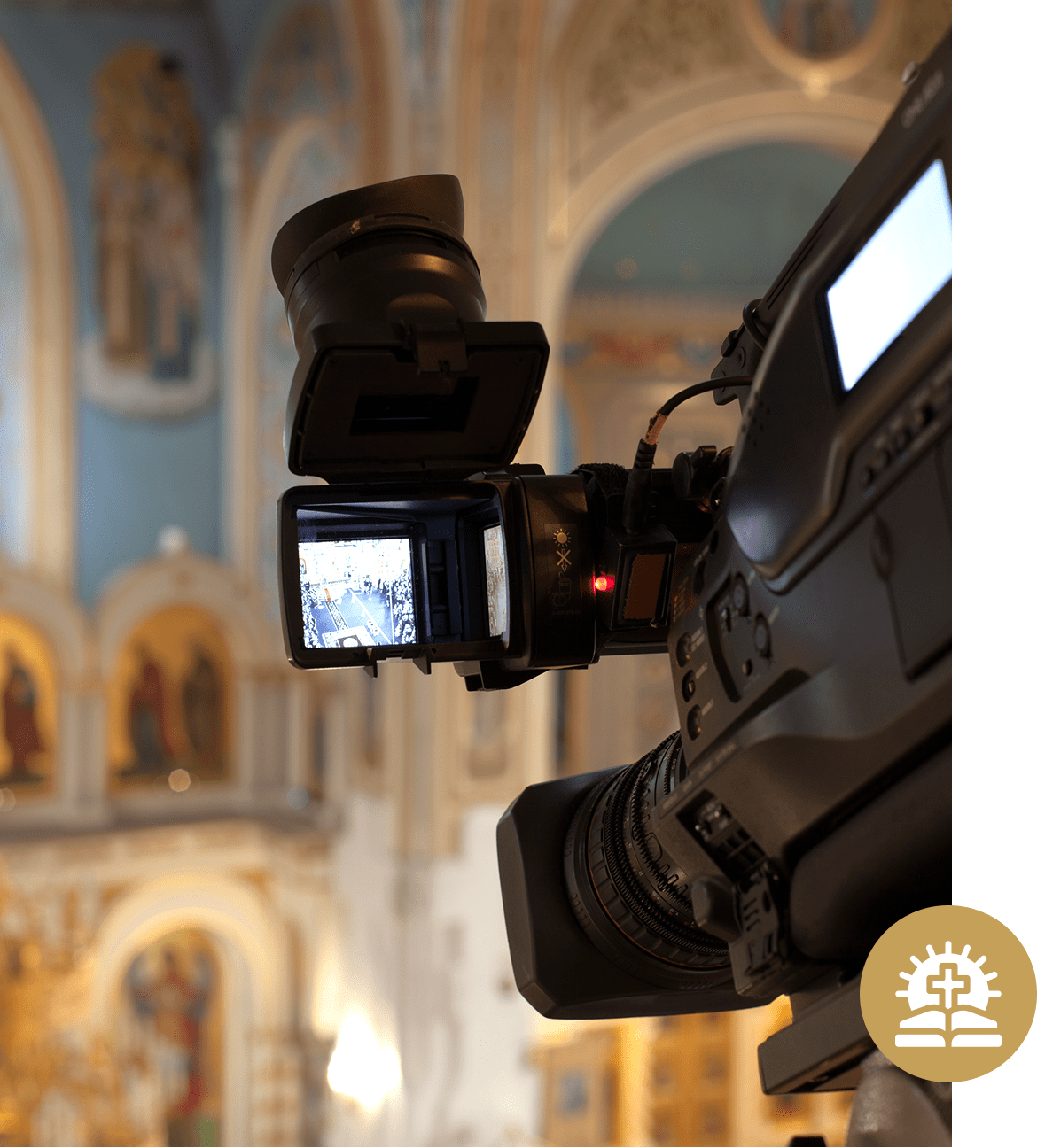 Camera filming inside a decorated church.